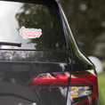 Load image into Gallery viewer, Car window with a decal reading 'I'd rather be with my dog' on a blurred natural background
